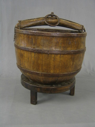 An Eastern circular coopered bucket raised on a stand 19"