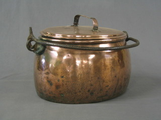 An oval 19th Century polished copper lidded cooking pot complete with zinc liner and iron swing handle (old repair to handle)