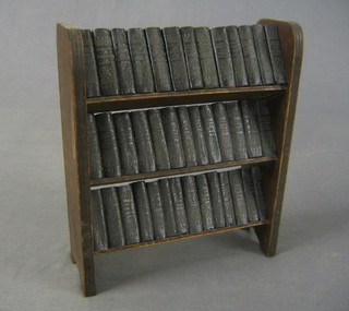 An Allied Newspapers miniature set of 40 volumes of Shakespeare contained in an oak 3 tier miniature bookcase