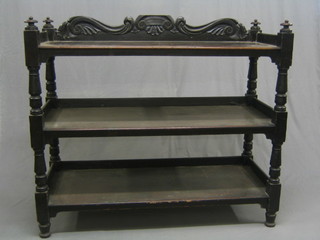 A Victorian mahogany 3 tier buffet with carved back, raised on turned supports 48"