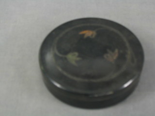 A Hardy's circular black Bakelite fly box and contents of flies 4"