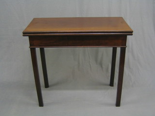 A rectangular Georgian mahogany tea table, raised on square supports 32"