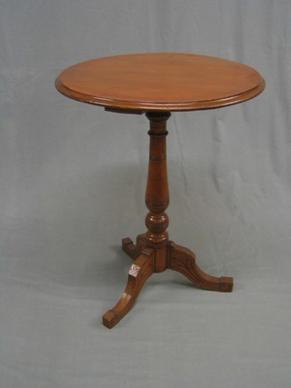 A circular Victorian walnut wine table, raised on a pillar and tripod column 22"