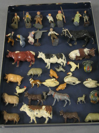 A collection of Britains figures including  scarecrow, 11 farming figures and 24 small animal figures