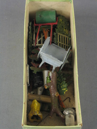 A collection of Britains hedges and fences, a garden roller and a dog cart