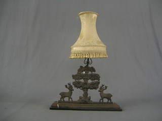 A Victorian cast iron door stop in the form of 2 stags standing beneath an oak tree, converted to a table lamp 18"