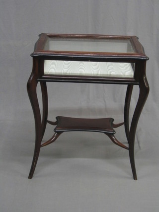 A 19th Century mahogany bijouterie table, raised on cabriole supports with shaped undertier 23"