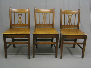 A set of 3 19th Century Country elm bar back chairs with pierced vase splat backs and solid seats, raised on square supports