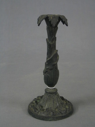 A handsome 19th Century cast iron candlestick with leaf decoration 10"