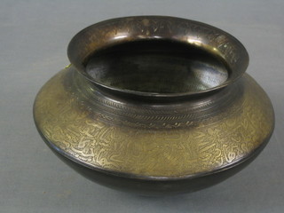 A circular engraved Eastern brass spitoon 12"