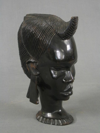 An African carved ebony portrait bust of a native 12"