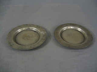 2 18th Century circular pewter dishes, the bases with London touch marks 9"