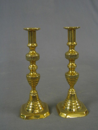 A pair of 19th Century brass candlesticks with ejectors 11"