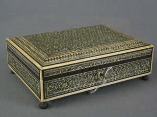 A rectangular Moorish ivory mosaic trinket box with hinged lid, raised on 4 bun feet 9"