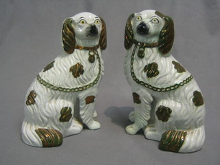 A pair of 19th Century Staffordshire figures of seated Spaniels 10" (1 with crack to base)