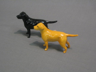 A Beswick figure of a standing  yellow Labrador 5" and a do. black Labrador (black leg f and r)