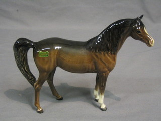 A Beswick figure of a standing brown Arab horse, gloss finish, model no. 1265