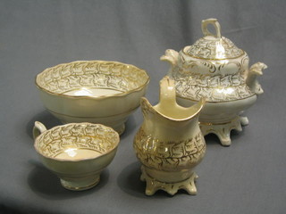 A Rockingham style 4 piece tea service with lidded sucrier, slop bowl, and tea cup