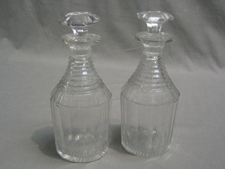 A pair of 19th Century panel cut and ring neck decanters  with stoppers