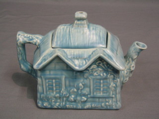 An Arthur Price blue glazed cottage teapot, the base marked Ye Olde Cottage Made in England