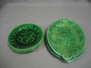 A pair of oval leaf shaped dishes 11" (1 chipped) and 6 circular green leaf shaped plates 7 1/2"