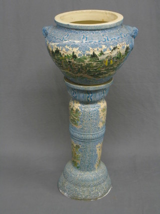 An Oriental twin handled jardiniere (heavily f and r), raised on a ditto base (some chips) 38" overall