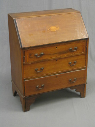 An Edwardian inlaid mahogany bureau, the fall front inlaid a shell above 3 long drawers, raised on bracket feet, 30"