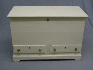 A white painted pine mule chest with hinged lid, the base fitted 2 drawers, raised on bracket feet 41"