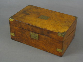 A Victorian walnut writing slope with hinged lid, the centre panel to the top replaced with a later brass panel, (veneers lifting to the side), with modern leathered interior 13"