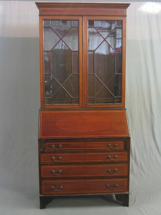 An Edwardian inlaid mahogany bureau bookcase, the upper section with moulded cornice, the interior fitted adjustable shelves enclosed by astragal glazed panelled doors, the fall front revealing a well fitted interior above 4 long drawers, raised on bracket feet 36"