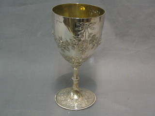A Victorian embossed silver goblet, monogrammed, London 1868, 10 ozs