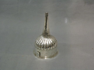 A George III circular silver wine funnel with demi-reeded and armorial decoration, detachable strainer and plain thumb piece, London 1815, makers mark IB, 3 ozs