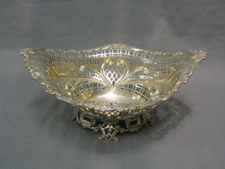 A Victorian pierced silver boat shaped basket, raised on pierced supports, London 1890, 23 ozs