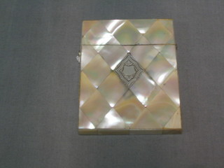 A 19th Century mother of pearl card case with hinged lid and silver diamond shaped panel to the centre 4"