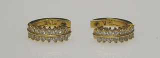 A pair of lady's gold hoop earrings set 16 diamonds