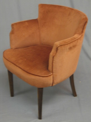 An Art Deco beech framed tub back chair upholstered in orange material