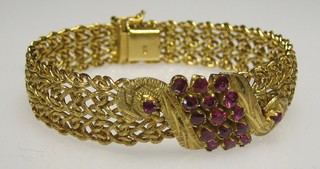 An Eastern 18ct pierced gold bracelet set 17 rubies
