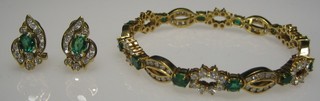 A suite of 18ct gold jewellery comprising bracelet and earring set diamonds and emeralds