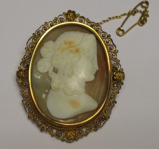A 19th Century shell carved cameo portrait brooch contained in a gilt metal mount