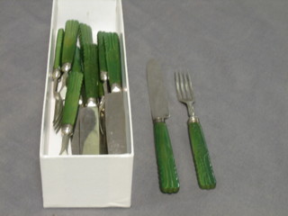 A set of 6 William IV silver bladed fruit knives and forks with carved stained green ivory handles, Sheffield 1825
