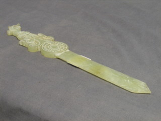 An Eastern carved jade coloured hardstone double bladed paper knife, the handle in the form of a dragons head 12" 