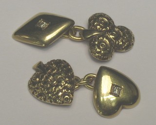 A pair of gold cufflinks in the form form of diamonds, clubs, spades and hearts set diamonds