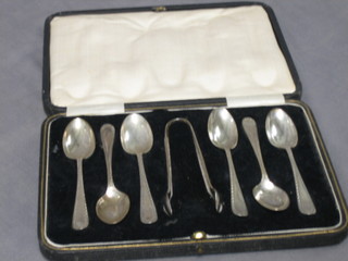 A set of 6 Old English pattern silver coffee spoons with bright cut decoration, Sheffield 1929 complete with tongs 3 ozs, cased