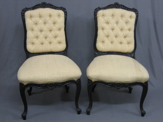 A pair of Victorian ebonised salon chairs with upholstered seats and backs, raised on cabriole supports (frames loose)