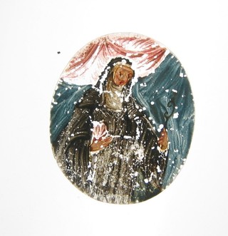 A miniature oval glass panel painted a nun 2 1/2"