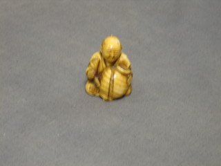 A 19th Century carved ivory Netsuke 1 1/2" (chip to base)