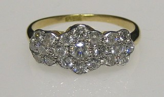 A lady's 18ct gold triple cluster dress ring set numerous diamonds, approx 0.95ct