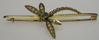 An Edwardian 9ct gold pendant in the form of a dragonfly set peridot and demi-pearls