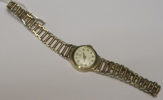 A lady's Rolex wristwatch contained in a 9ct gold case on an integral 9ct gold Rolex bracelet, complete with leather case