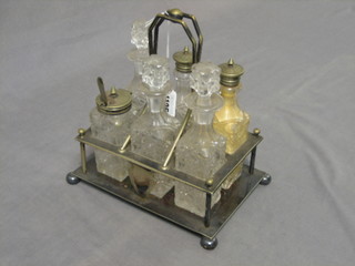 A silver plated and cut glass 6 piece cruet stand complete with bottles